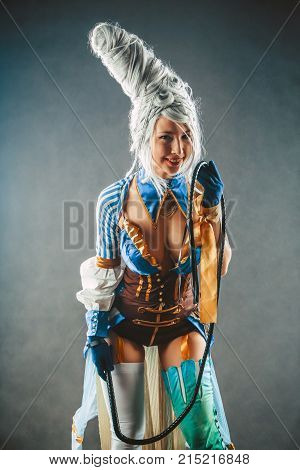 Beautiful Woman Trainer With The Whip In A Sexy Circus Suit