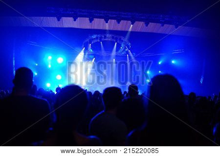 Texture Blur Scene Multicolored Lights And Smoke In Concert With Silhouettes Of Peoplebackground For