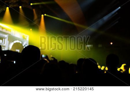 Texture Blur Scene Multicolored Lights And Smoke In Concert With Silhouettes Of Peoplebackground For