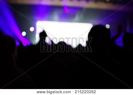 Texture Blur Scene Multicolored Lights And Smoke In Concert With Silhouettes Of Peoplebackground For