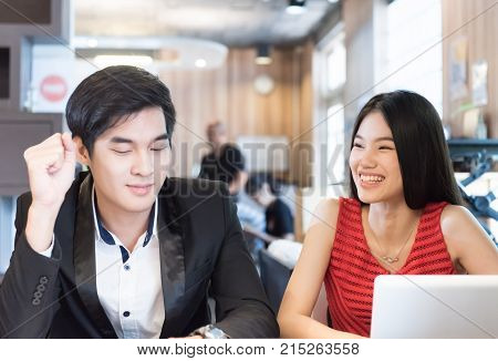 bisuness people discussing with notebook or laptop in office.
