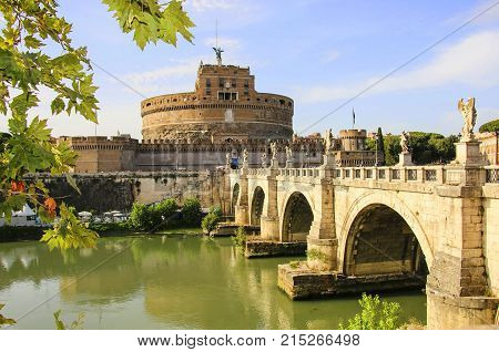Saint Angel Castle and Saint Angel bridge over the Tiber river in Rome Italy.