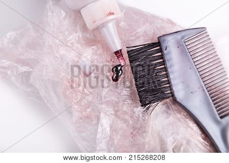 Close-up Of Chemical Hair Color Dye Set With Comb Brush