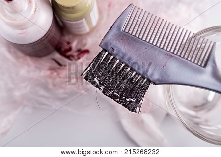 Close-up Of Chemical Hair Color Dye Set With Comb Brush