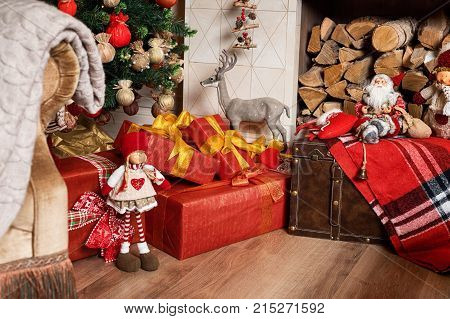Cozyness And Home Comfort. Decorated Fireplace With Firewood. Winter Holidays Room Interior, Christm