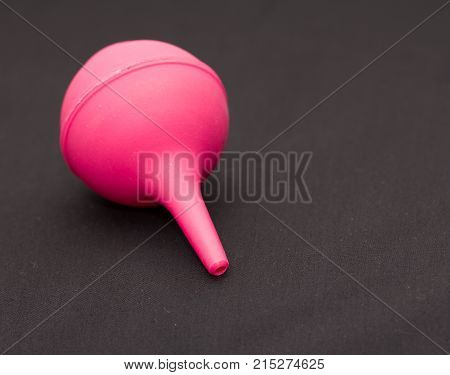 enema on a black background . Photos in the studio
