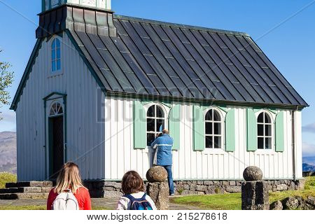 Tourists Near Thingvallakirkja Church