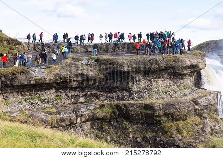 Tourists At Viewpoint Over Gullfoss Waterfall
