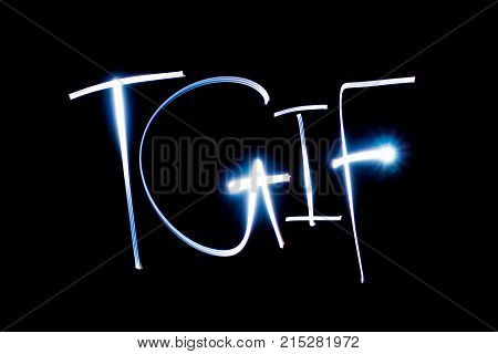 Light painting of the letters TGIF on black background.