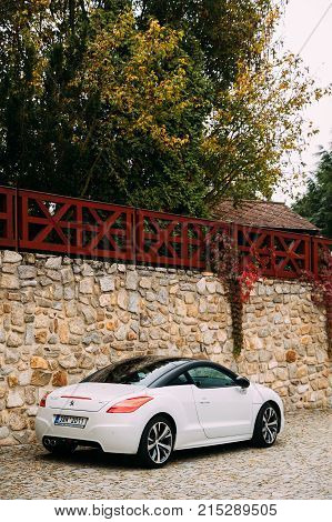 Cesky Krumlov, Czech Republic - September 27, 2017: Back View Of White Peugeot RCZ Car Parked In Street.
