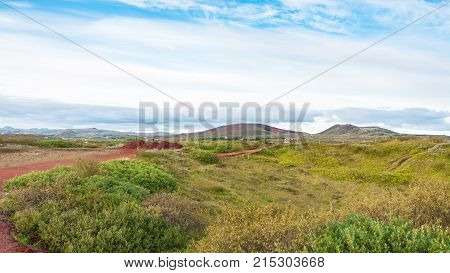 Landscape With Red Volcanic Soil In Iceland