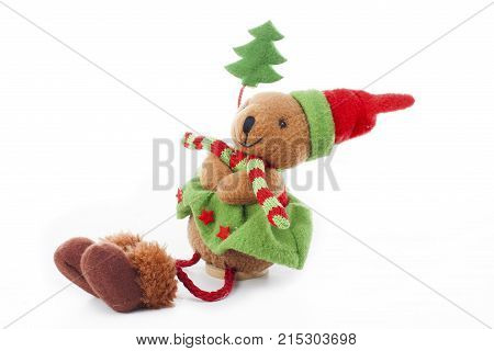 Christmas bear decoration. Cute plush toy decor for christmas. Mini Teddy bear wearing christmas costume. Winter holiday isolated white photo. Christmas concept. Cute.