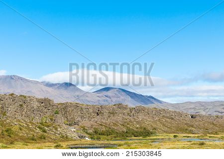 Logberg Mountains And Oxara River In Thingvellir
