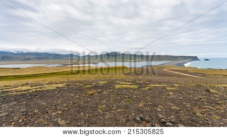 Dyrholaey Cape And Volcanic Beach In Iceland