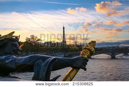The Seine river and Eiffel Tower seen pont Alexandre III . Eiffel Tower is the French most visited monument .