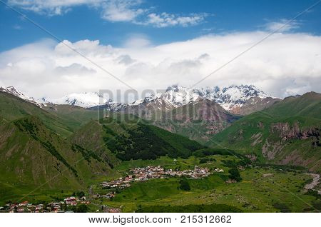 Holy Trinity Church in Georgia. Under Mount Kazbegi. Spring Or Summer Season.