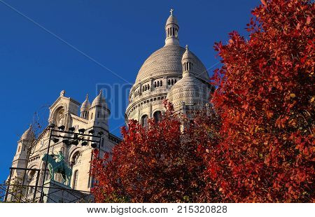 The basilica Sacre Coeur is a Roman catholic church located at the summet of the butte Montmartre , the highest point in Paris.