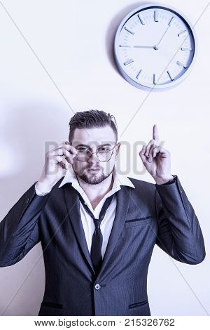You're Late! Angry Businessman Is Pointing At  Clock Suggesting You Are Late For Work. (work, Respon