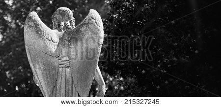 Rear View Of Angel Of Death As A Symbol Of The End Of Life. Ancient Statue. (religion Eternal Life I