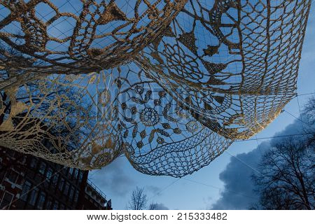 Amsterdam Netherlands - January 14 2017: Crocheted and illuminated giant bedspread (