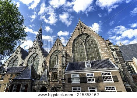 facade of the Oude Kerk or Old Church in Amsterdam, Netherlands.