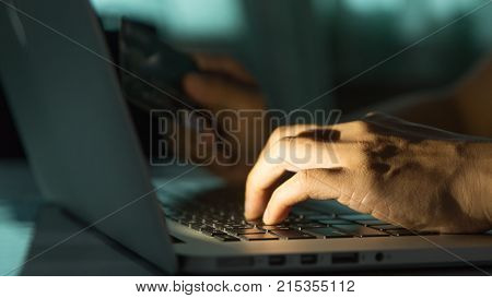The Concept Of Credit Card Theft. Hackers With Credit Cards On Laptops Use These Data For Unauthoriz