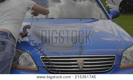 BARNAUL - AUGUST 22: Day of the city. Application of airbrushing on the hood of the car on August 22 2017 in Barnaul Russia.