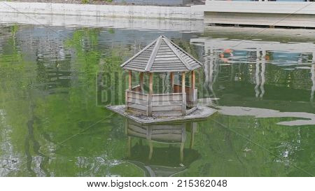 Wooden Duck House On A Pond In Rural.