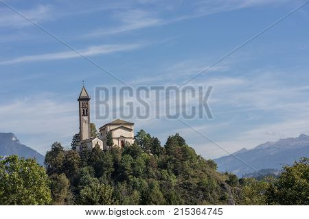 Castle on the hill landscape mountains and peaks in background. Trentino South Tirol Castello Molina Di Fiemme Alto Adige Italy - Saint George Church
