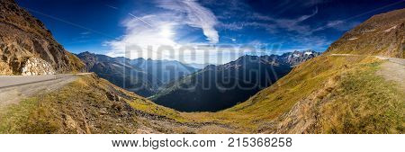 Timmelsjoch High Alpine Road landscape panorama. Mountains and peaks covered with glaciers and snow natural environment. Hiking in the Passo del Rombo. Ötztal alps Austria and Italy border Europe