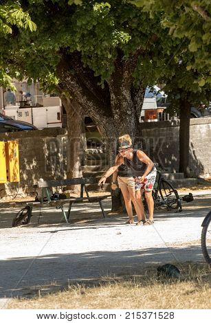 SAULT FRANCE - JUNE 25 2017: Couple playing petenque boules in Sault. Provence France.