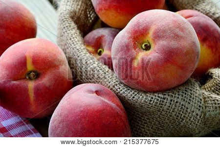 Many Fresh Peach with water drops and shadow on wooden background