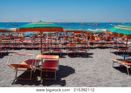 umrellas and chairs on the beach of Positano - famous old italian resort, Italy