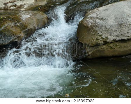 Waterfalls in the mountains of the North Caucasus surrounded by beautiful autumn nature