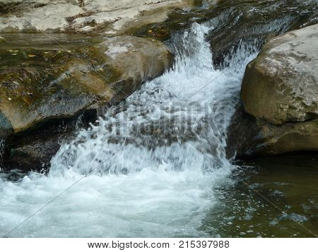 Waterfalls in the mountains of the North Caucasus surrounded by beautiful autumn nature