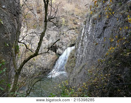 Waterfalls in the mountains of the North Caucasus surrounded by beautiful autumn nature