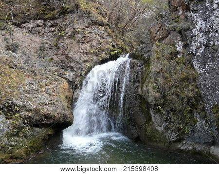 Waterfalls in the mountains of the North Caucasus surrounded by beautiful autumn nature