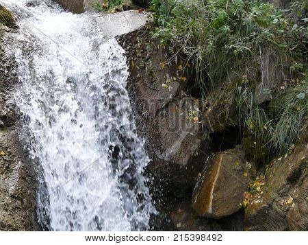 Waterfalls in the mountains of the North Caucasus surrounded by beautiful autumn nature