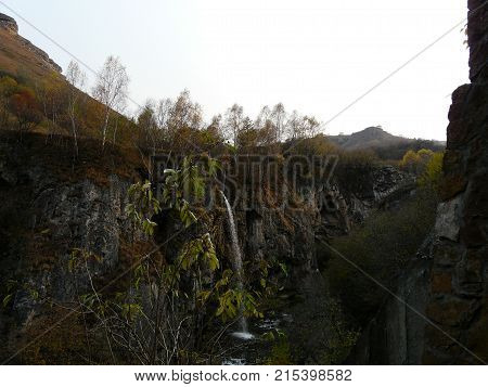 Waterfalls in the mountains of the North Caucasus surrounded by beautiful autumn nature