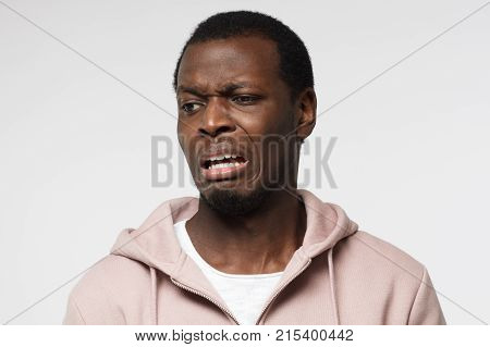 Disguting! Shocked Young African American Man Looking At Something Unpleasant And Bad, Isolated On G