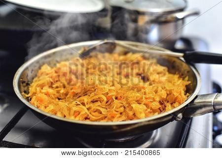 Fried Cabbage on skillet cooking process kitchen