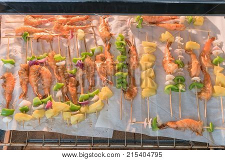 Homemade Skewer With Delicious Grilled Shrimps On Parchment Paper