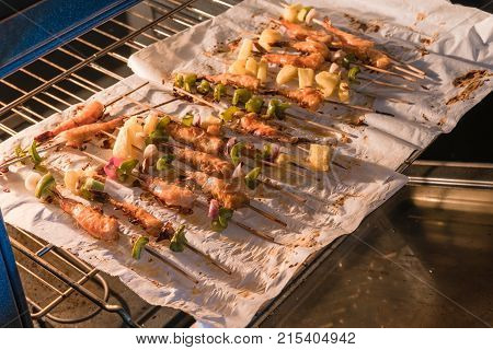 Homemade Skewer With Delicious Grilled Shrimps On Parchment Paper