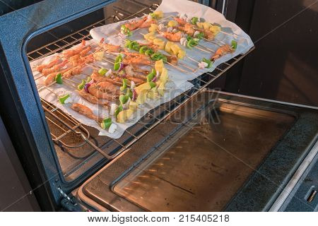 Homemade Skewer With Delicious Grilled Shrimps On Parchment Paper