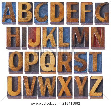complete English alphabet set - collage of 26 isolated vintage wood letterpress printing blocks, scratched and stained by blue, red and black ink, digital painting filter applied