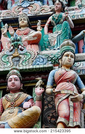 The decorations on the façade of an Indian temple.