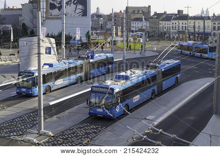 ARNHEM NETHERLANDS - NOVEMBER 26 2016: Blue trolley buses at the Arnhem central station. The Arnhem trolleybus is the only existing trolleybus network in the Benelux and one of the largest in Western Europe.