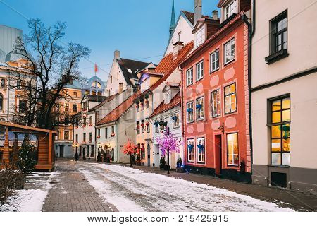 Riga, Latvia. Decorated Facades Of Old Houses On Meistaru Street In Evening. Winter New Year Holiday Season.