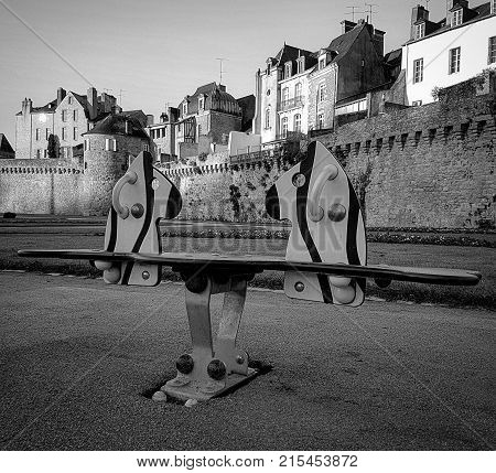 Children's games along the rempart, garden of Vannes, Bretagne, France, in black and white, novembre 2017
