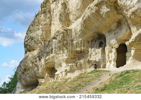 A tourist stands on the natural boundary of Mariam Dere near Bakhchisarai.  